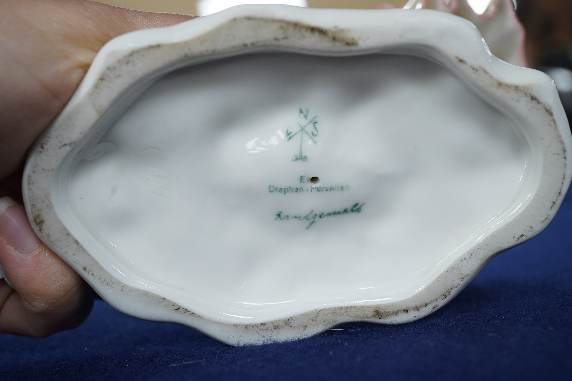 An early 20th century Coalport jewelled cabinet cup and saucer, a Karl Ens grop and a Plane figure